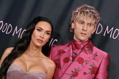 Megan Fox and Machine Gun Kelly at the 'Good Mourning' premiere, wearing coordinated pink outfits.