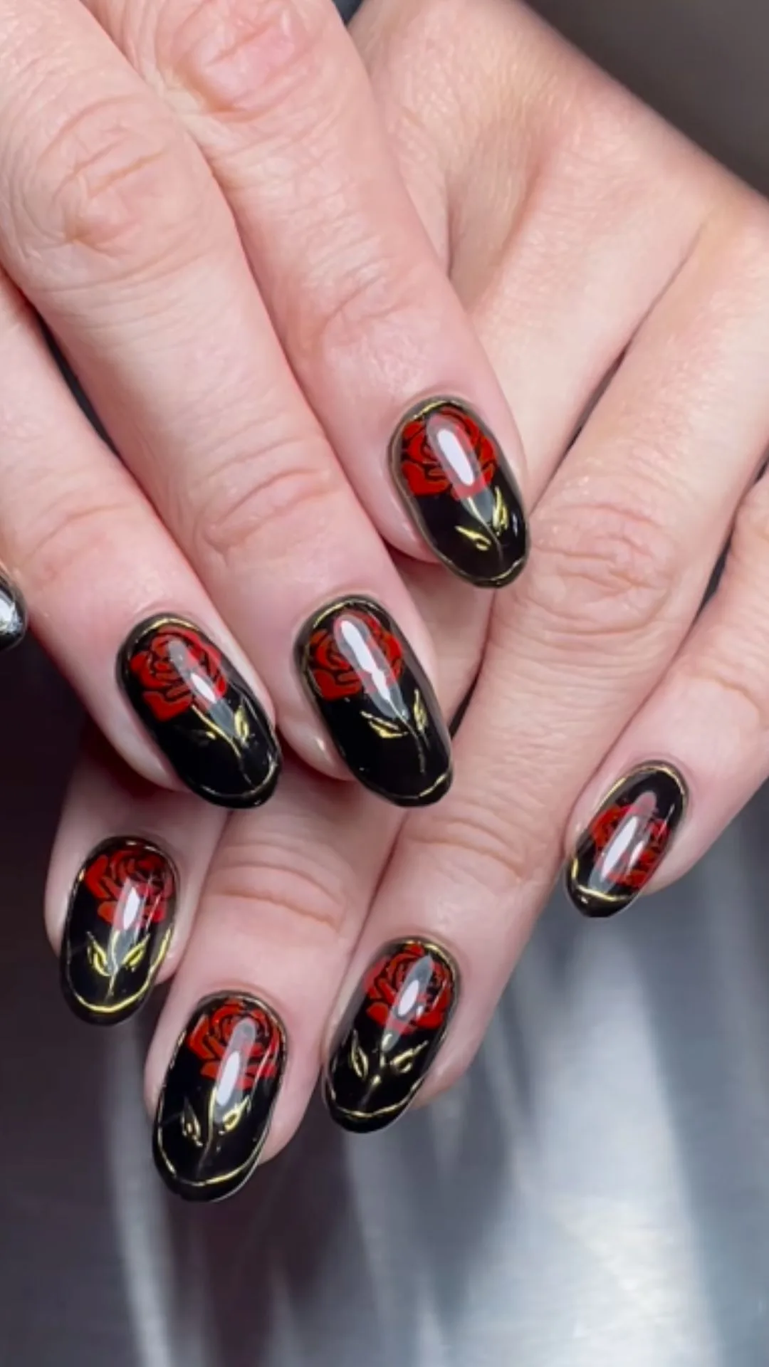 Black nails with red rose illustration