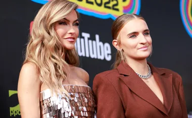 Chrishell Stause at the People's Choice Awards 2022 with a companion, wearing a sequined dress.