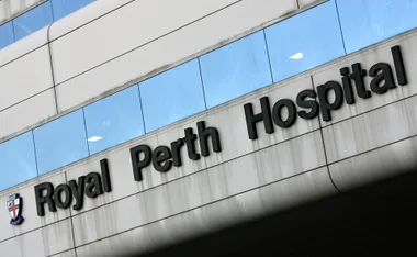 "Sign reading 'Royal Perth Hospital' on building exterior."