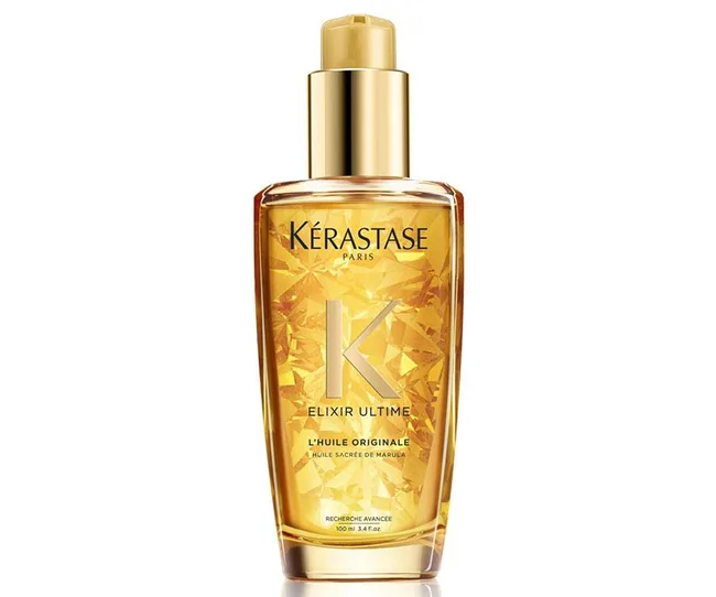 Kérastase Elixir Ultime L'Huile Originale, a golden hair oil in a decorative bottle with a pump.