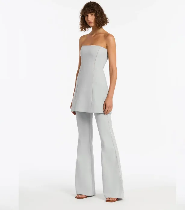 How to Wear Dresses Over Pants: 8 Trendy Pieces to Shop | ELLE How to Wear Dresses Over Pants: 8 Trendy Pieces to Shop | ELLE