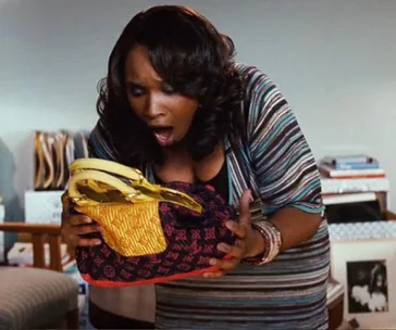 Jennifer Hudson as Louise in 'Sex and the City' carrying a Louis Vuitton bag.