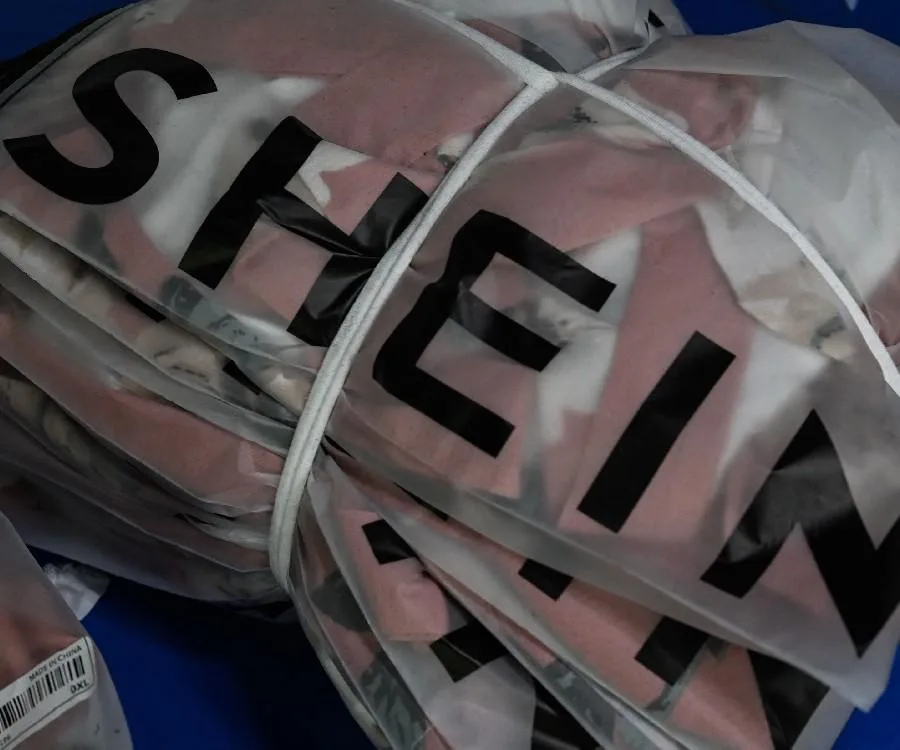 Shein plastic bags with clothing in them.