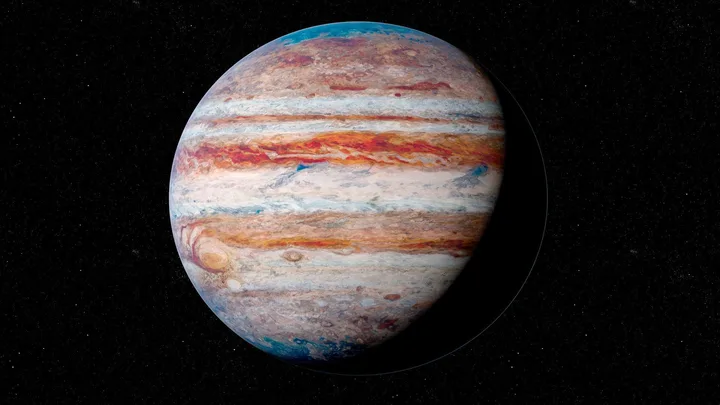 Planet Jupiter with colorful bands and Great Red Spot, against a starry black background.