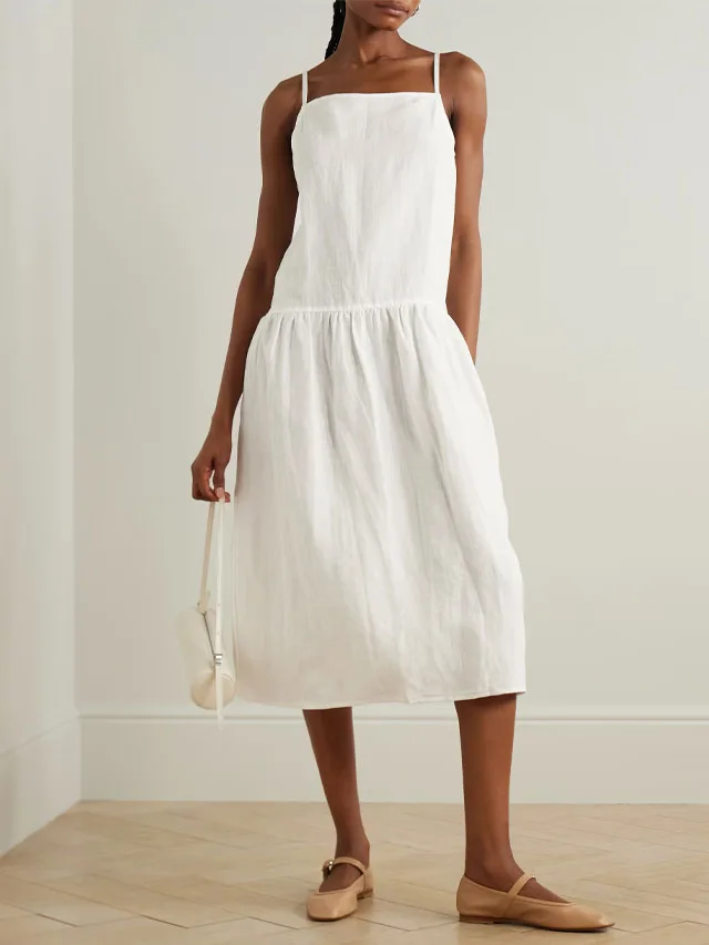 Model wearing a white midi dress