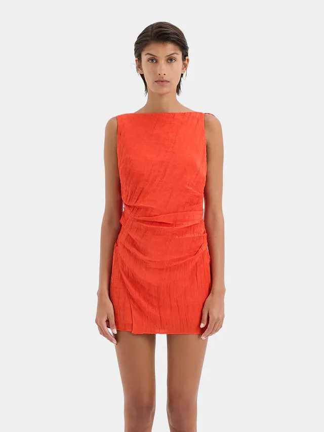 Model wearing an orange mini dress