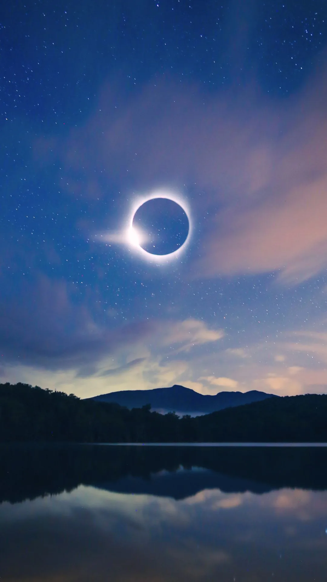 Solar eclipse in the sky over mountains 