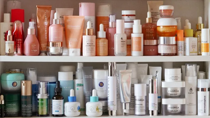 bathroom shelf covered in beauty products