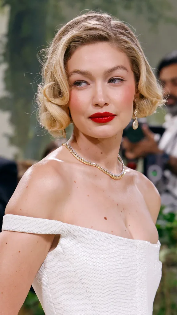 gigi hadid wearing red lipstick at the met gala 2024