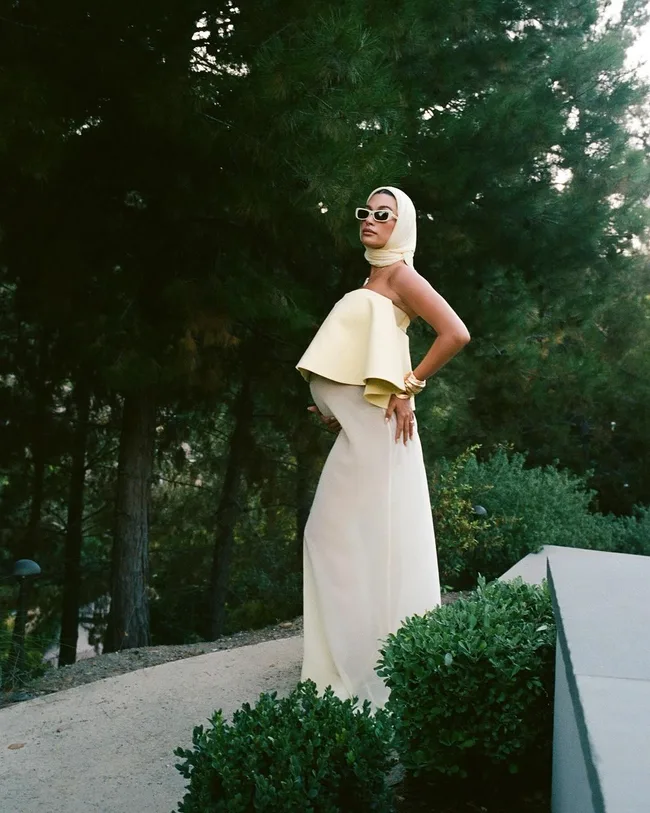 hailey bieber wearing yellow dress during pregnancy