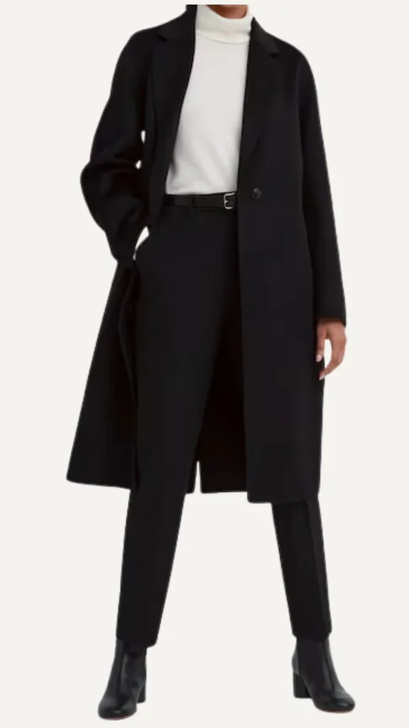 This classic black coat from uniqlo hits just below the knee, and features a tailored collar, and a single-button closure