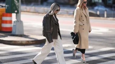 woman wears brown leather jacket