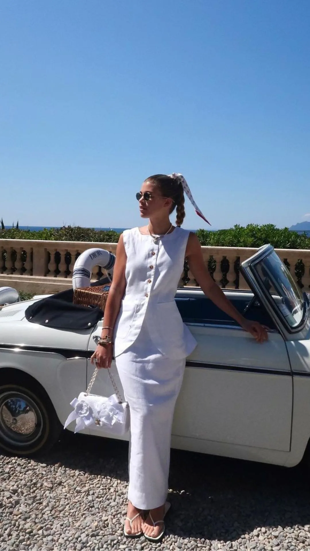 sofia richie in white skirt and vest during wedding week event