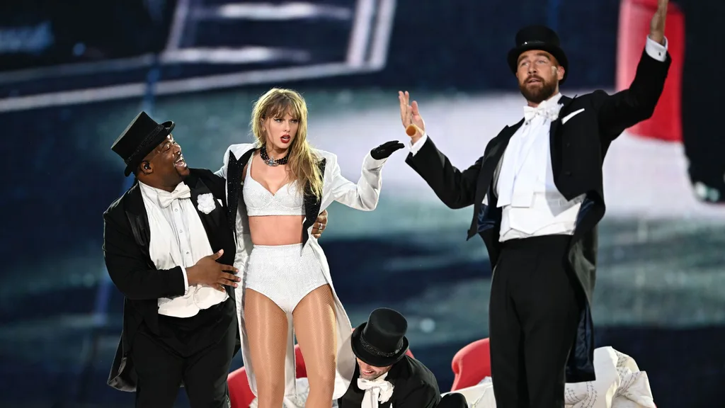 Travis Kelce performs with Taylor Swift at the Eras Tour.