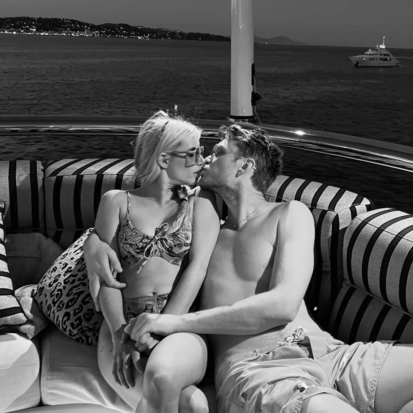 Emma Roberts and Cody John kissing.