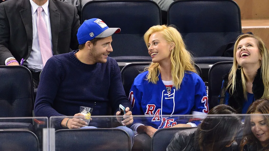 Margot Robbie and Tom Ackerley at an ice hockey game in 2014