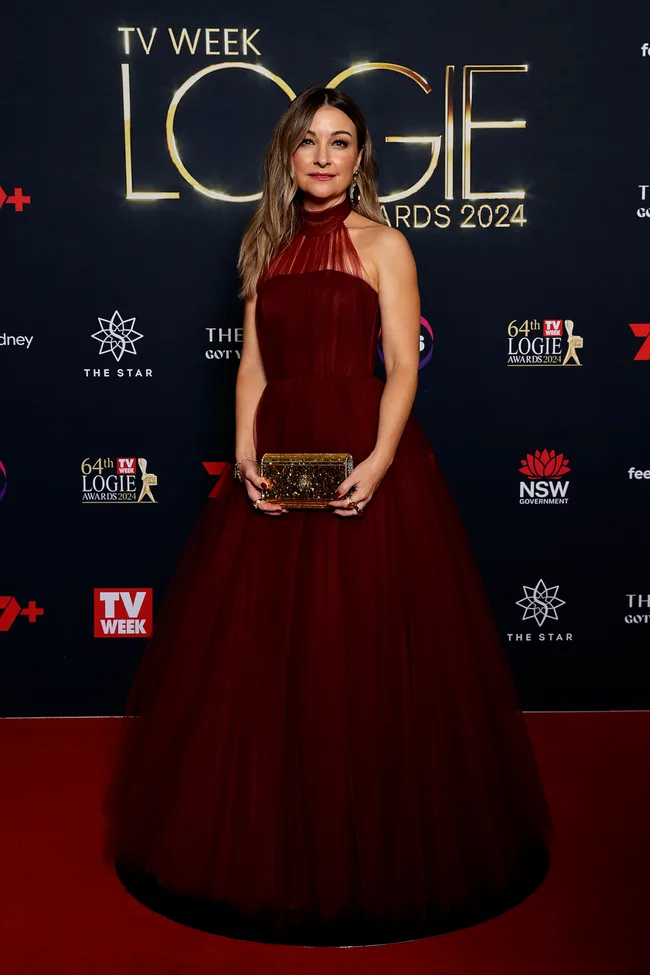 kate miller heidke on the logies red carpet in a red dress