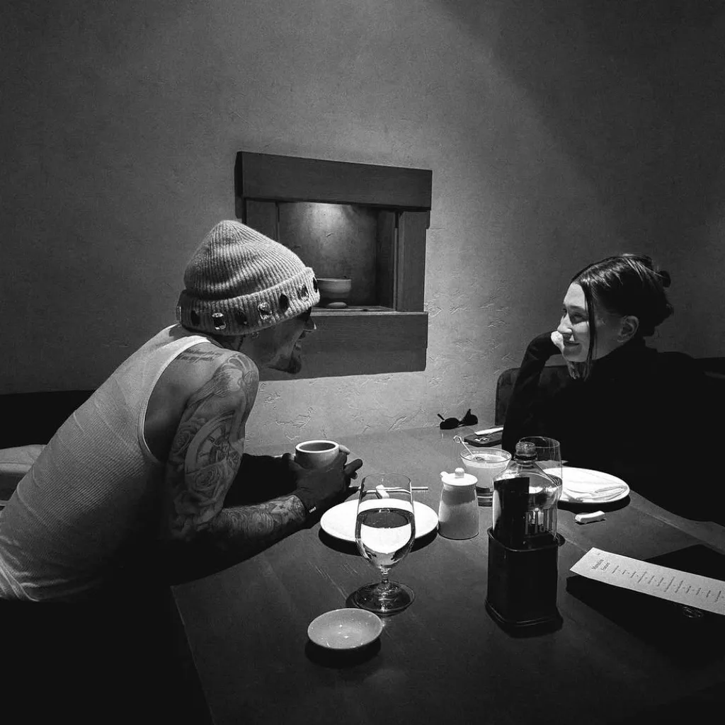 Justin Bieber posts a romantic snap of him and wife Hailey Beiber having dinner to Instagram.