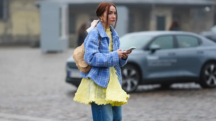 Woman holding a phone.