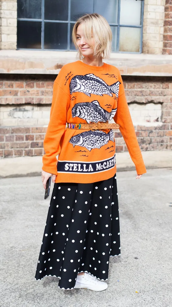 woman wearing fish pisces star sign jumper