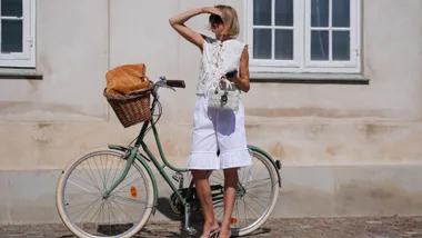 woman with bicycle at copenhagen fashion week