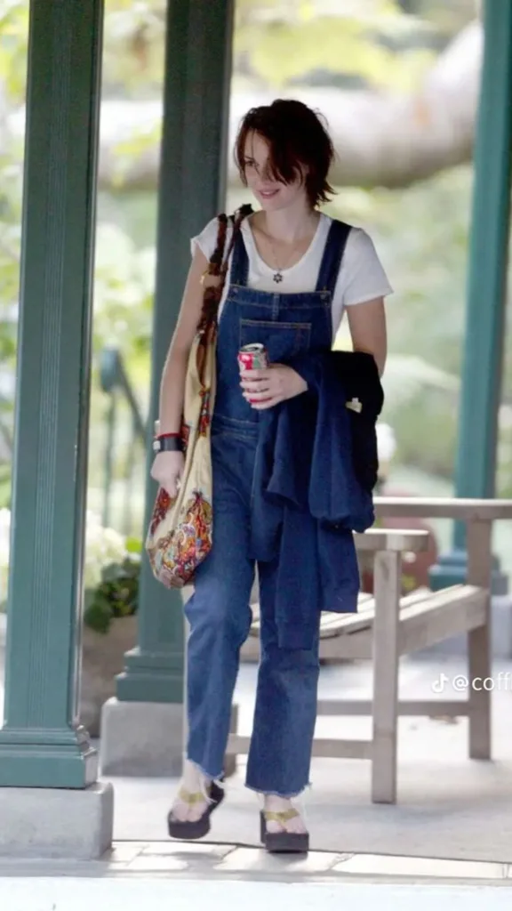 Winona Ryder wearing denim overalls in the 90s