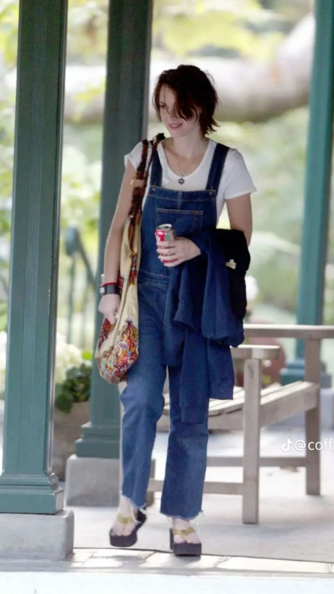 Winona Ryder wearing denim overalls in the 90s 