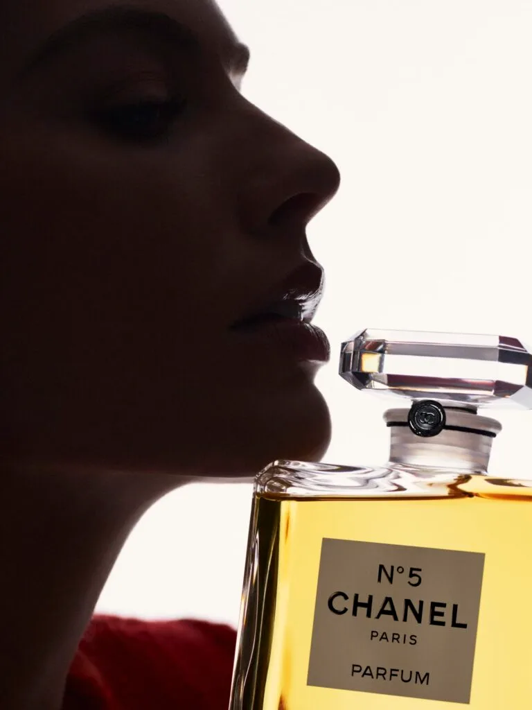 margot robbie chanel no5 campaign with her silhouette and the chanel perfume bottle