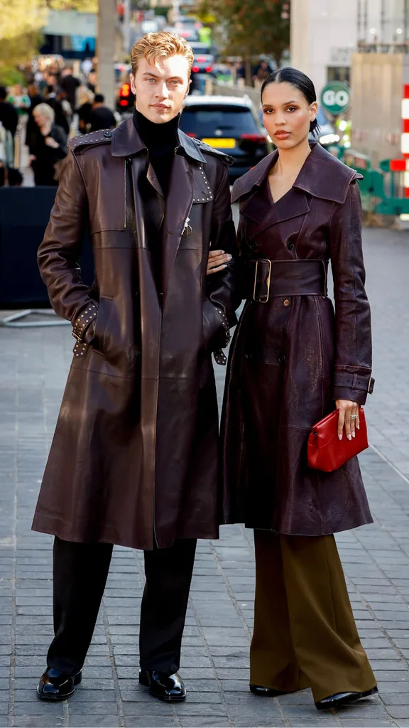 couple lucky blue and nara smith at london fashion week wearing burgundy coats