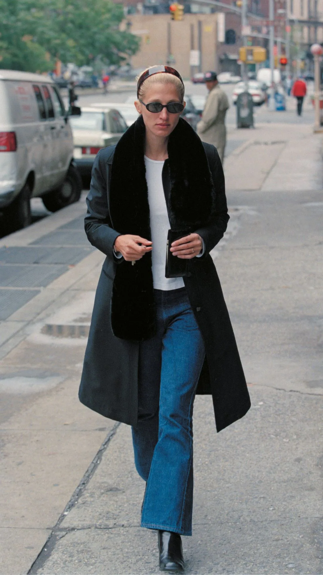 carolyn kennedy- wearing jeans and a coat exemplifying her minimal and elegant personal style with the three word method