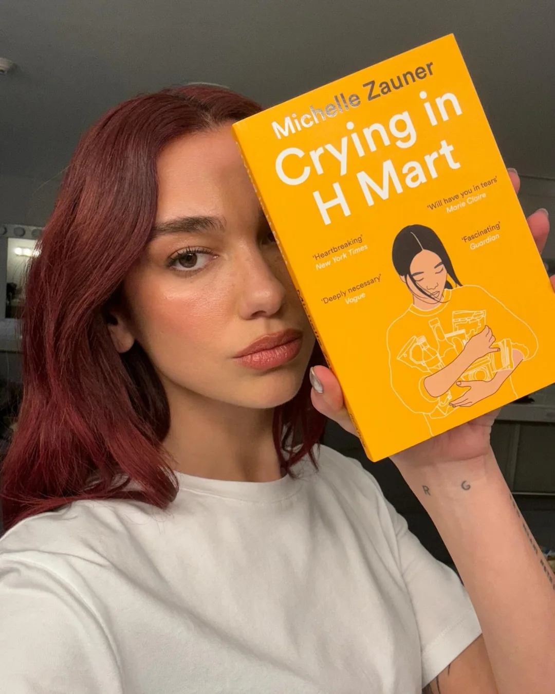 celebrities carrying books Dua Lipa