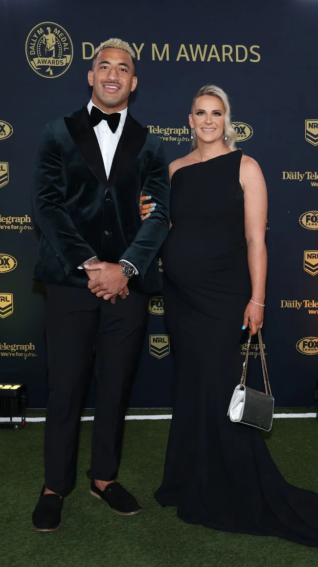 Viliame Kikau of the Bulldogs and Brittany Carey on the dally m red carpet