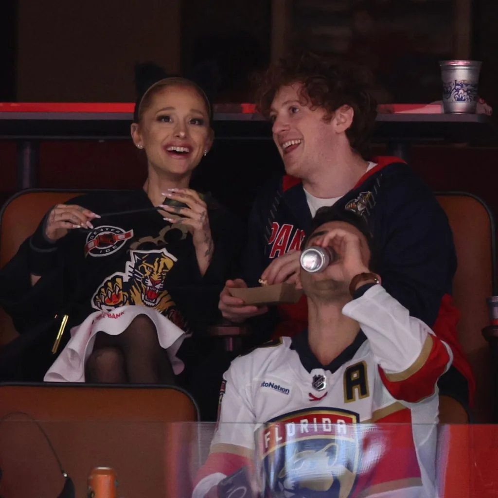 Ariana Grande and Ethan Slater look on prior to Game One of the 2024 Stanley Cup Final between the Florida Panthers and the Edmonton Oilers at Amerant Bank Arena on June 08, 2024 in Sunrise, Florida.