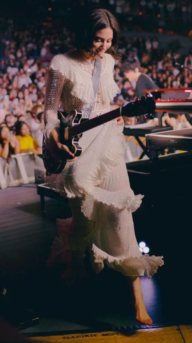 gracie abrams on stage in crochet dress