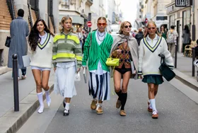 A group of friends outside the Lacoste show during Paris Fashion Week