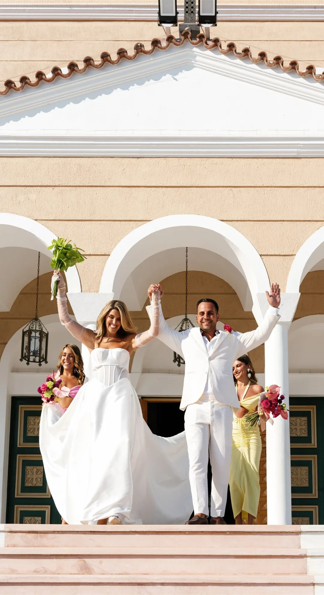 Girls With Gems CEO Lia Georgantis wedding photo with the bride and groom outside the church