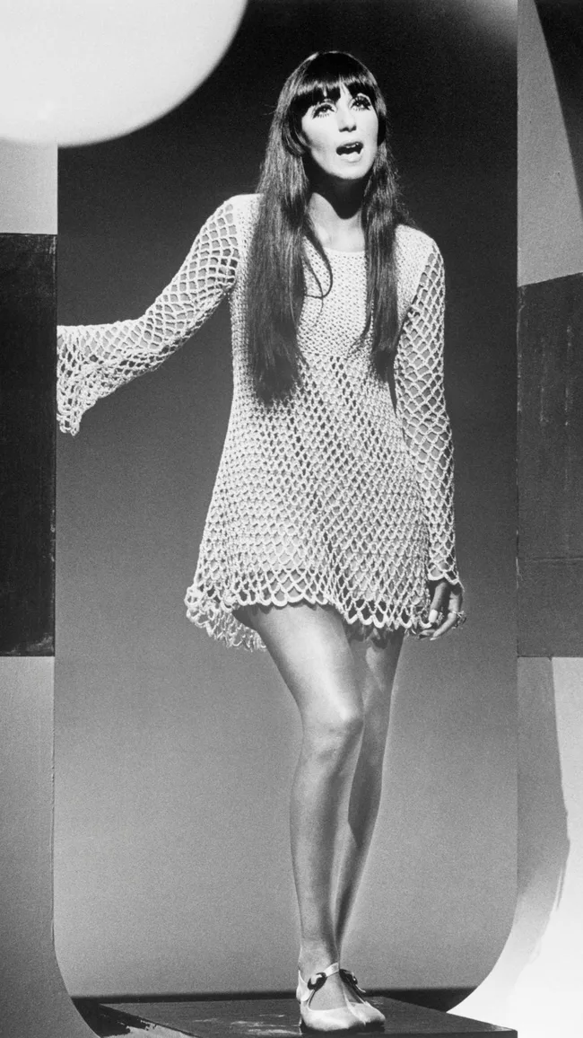 cher in crochet mini dress