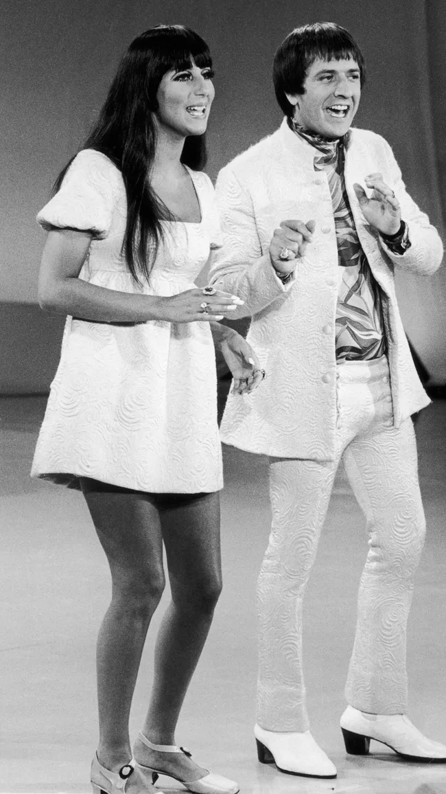 cher best looks wearing a white mini dress while performing with sonny