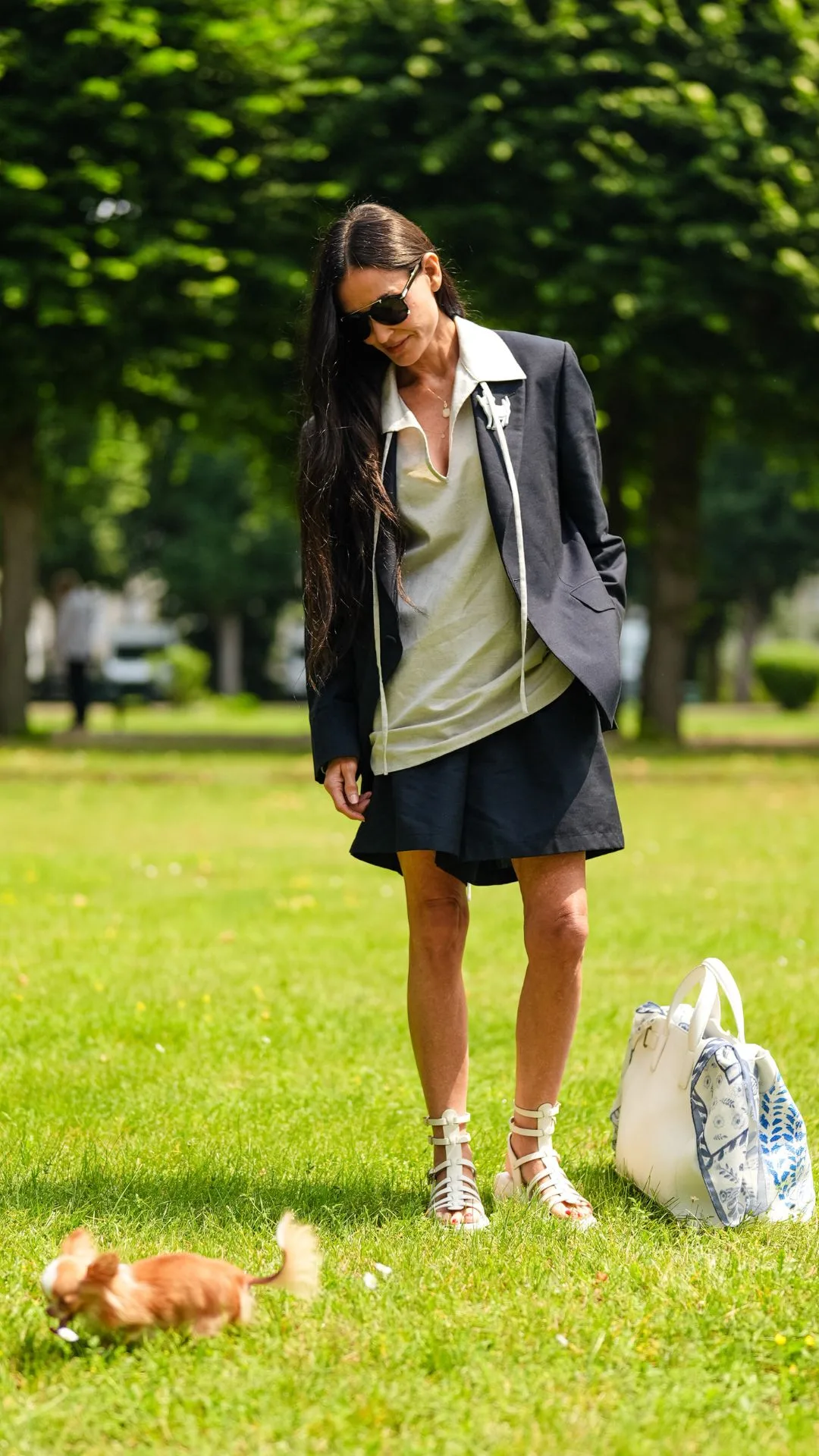 demi moore at the dog park with pilaf wearing stylish shorts and a blazer