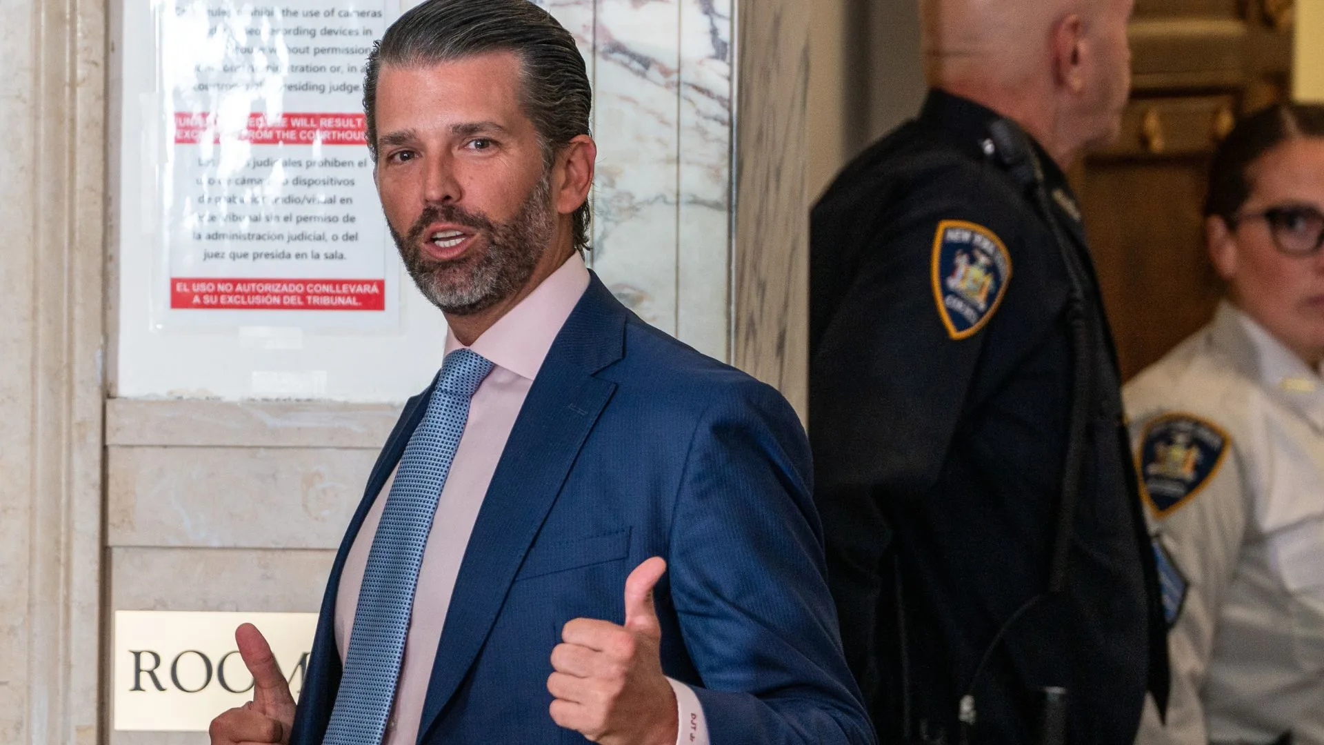 Donald Trump Jr. steps out for a break at former President Donald Trump's civil fraud trial on November 02, 2023 in New York City. Trump's children, Donald Jr., Eric and daughter Ivanka, are all expected to testify at their father's trial in the coming days. The former president may be forced to sell off his properties after Justice Engoron canceled his business certificates and ruled that he committed fraud for years while building his real estate empire after being sued by Attorney General Letitia James, seeking $250 million in damages. The trial will determine how much he and his companies will be penalized for the fraud. 