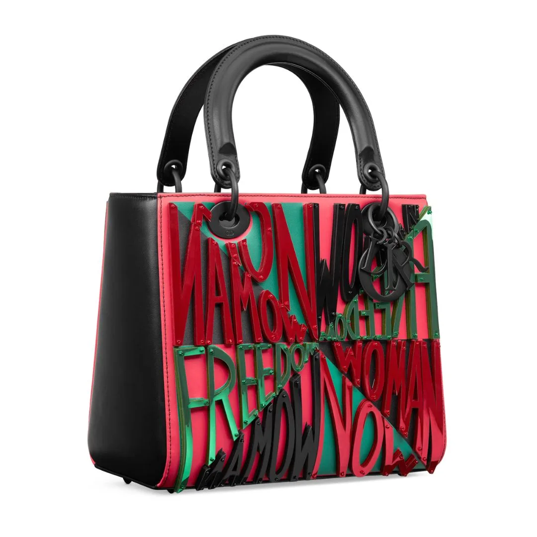 lady dior art project bag with red green and black writing