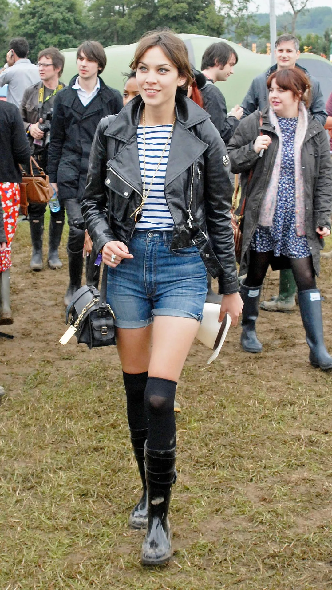 millennial fashion icon alexa chung wearing denim shorts hunter gumboots and a leather jacket