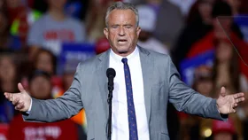 Former Republican presidential candidate Robert F. Kennedy Jr. gestures as he speaks ahead of Former US President and Republican presidential candidate Donald Trump at a campaign rally at the Fiserv Forum in Milwaukee, Wisconsin, November 1, 2024.