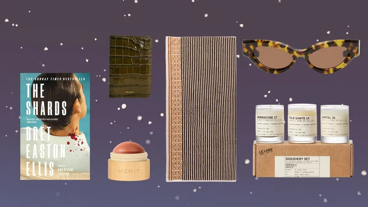 Sagittarius gift ideas including The Shards by Bret Easton Ellis, a Sezane Passport Holder, a Merit Flush Balm blush, a Leleabo Candle Discover set a Loewe Towel and Nanushka sunglasses