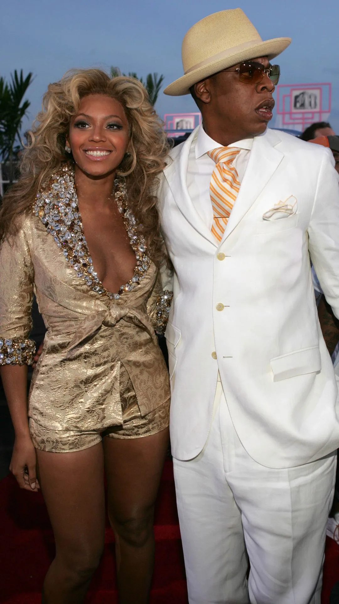 Beyonce and Jay Z make their red carpet debut in 2004 at the MTV VMAs with beyonce wearing a gold shorts set and jay z in a white suit