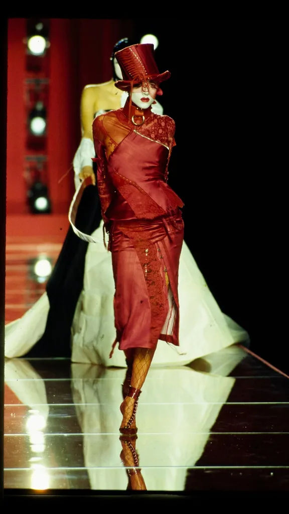 Model walks Christian Dior's Fall 2000 Haute Couture Runway collection designed by John Galliano.
