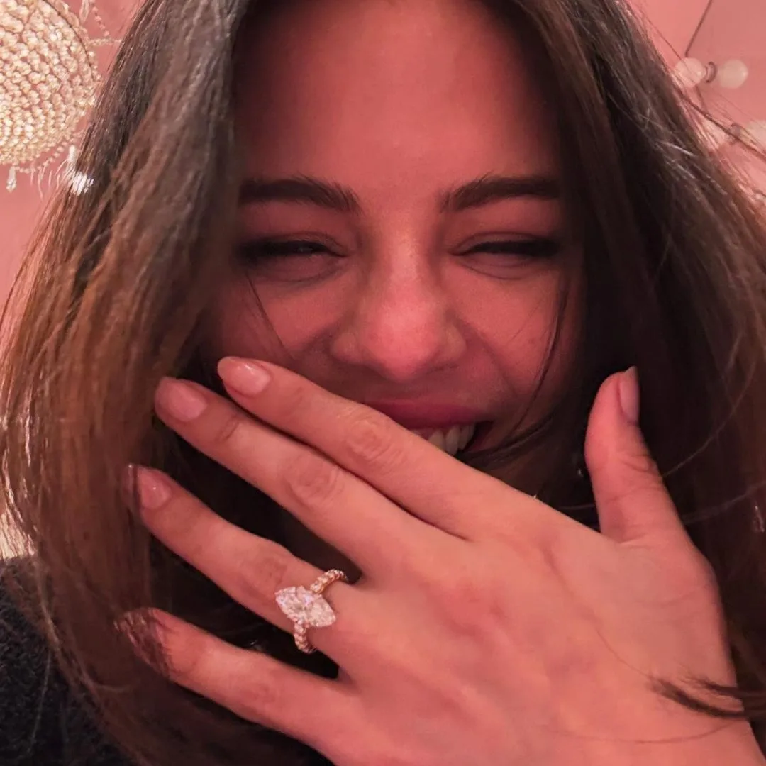 Selena Gomez showing off her marquise diamond engagement ring