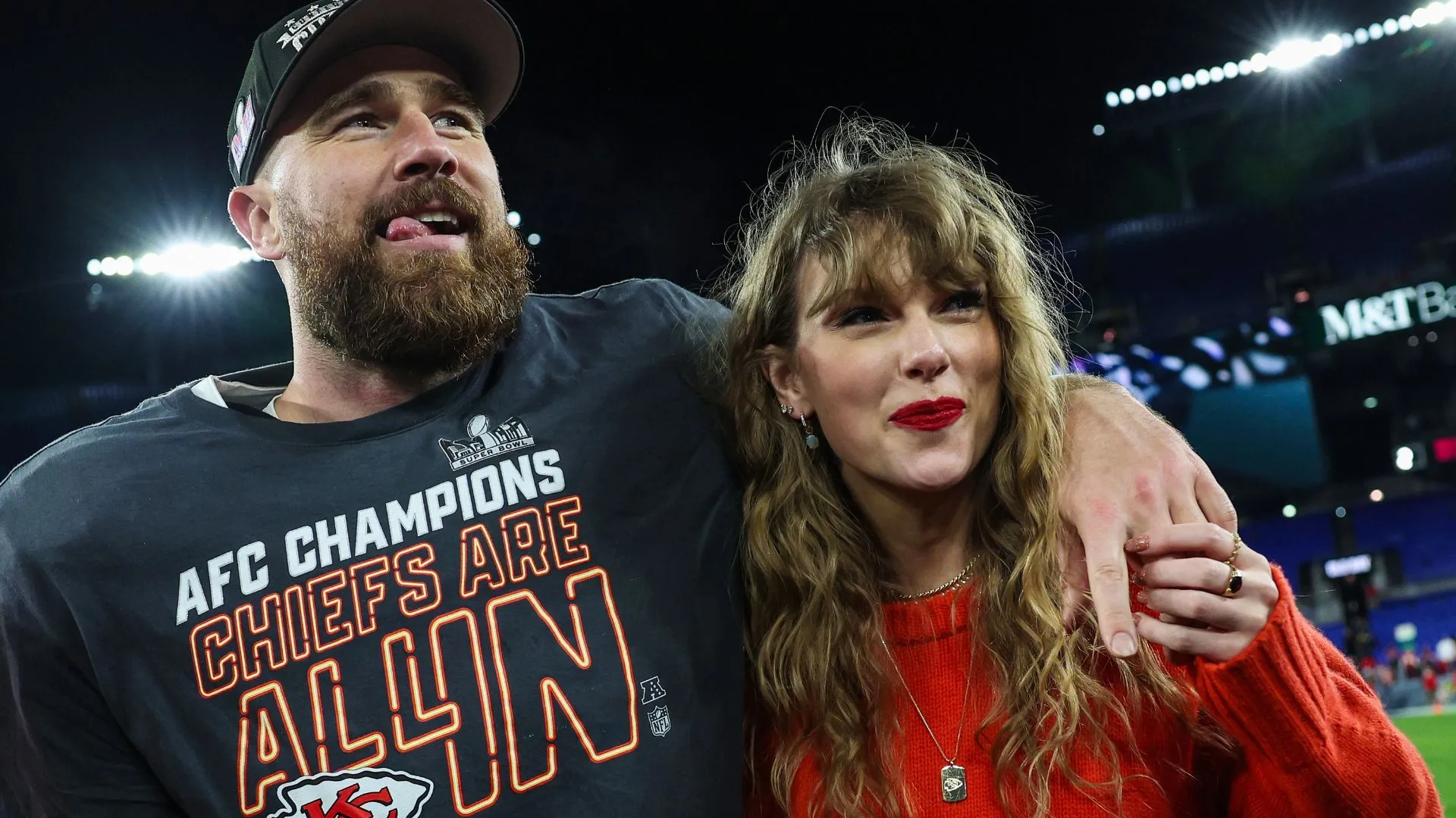 Travis Kelce #87 of the Kansas City Chiefs (L) celebrates with Taylor Swift after defeating the Baltimore Ravens in the AFC Championship Game at M&T Bank Stadium on January 28, 2024 in Baltimore, Maryland. (