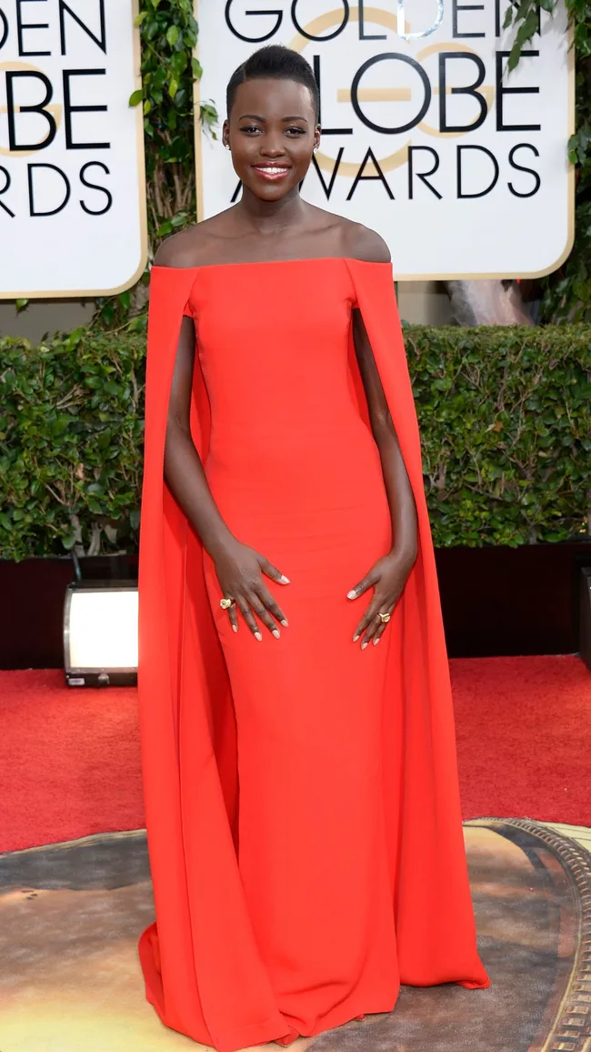 best-golden-globes-dresses-lupita-nyong'o in a red cape dress